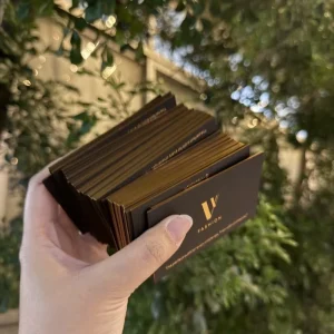 Custom Black Art Paper Business Card with Gold Foil Edge, Debossed Logo, and Hot Stamp