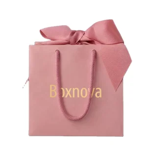 Custom Eco-Friendly Matte Pink Art Paper Gift Bag with Gold Foil Logo Ribbon Rope Handles for Jewelry Cosmetics