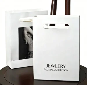Custom Logo Die Cut Handle White Cardboard Paper Bags Luxury Boutique Shopping Gift Bags for Retail Clothing Cosmetics Jewelry