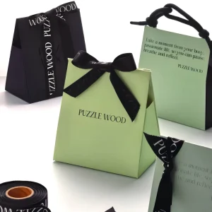 Custom Logo Luxury Paper Cosmetic Gift Bags With Black Ribbon Bow And Rope Handle For Beauty Retail Gift Set Packaging