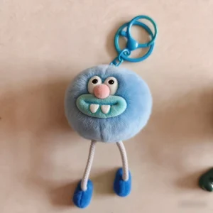 Hot selling customized character design pompom shaped teeth keychain pendants for school bags plush toys keychains