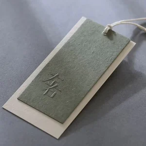 Luxury Eco Friendly Light Green Embossed Swing Hang Tag Custom Logo Recyclable Paper Material Bags for Clothing and Shoes