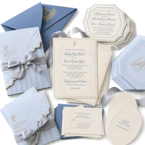 Luxury Embossed Wedding Invitation Suite with Blue Envelope, Ribbon Wrap and Custom Floral Letterpress Design