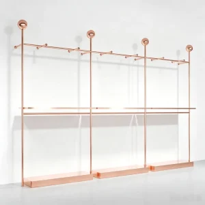 Modern Rose Gold Metal Display Rack with Decorative Finials and Top Hooks for Women’s Boutique Store