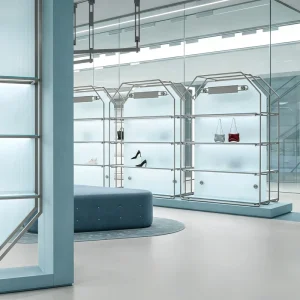 Turnkey Fashion Retail Store Design with Modular Stainless Steel Fixtures Blue Glass Displays and Custom Clothing Racks